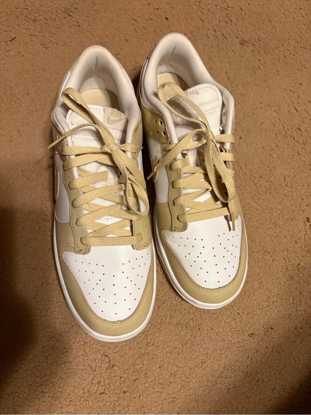 Nike Dunk Low Retro men’s sneakers in the Team Gold/White colorway. Classic Dunk